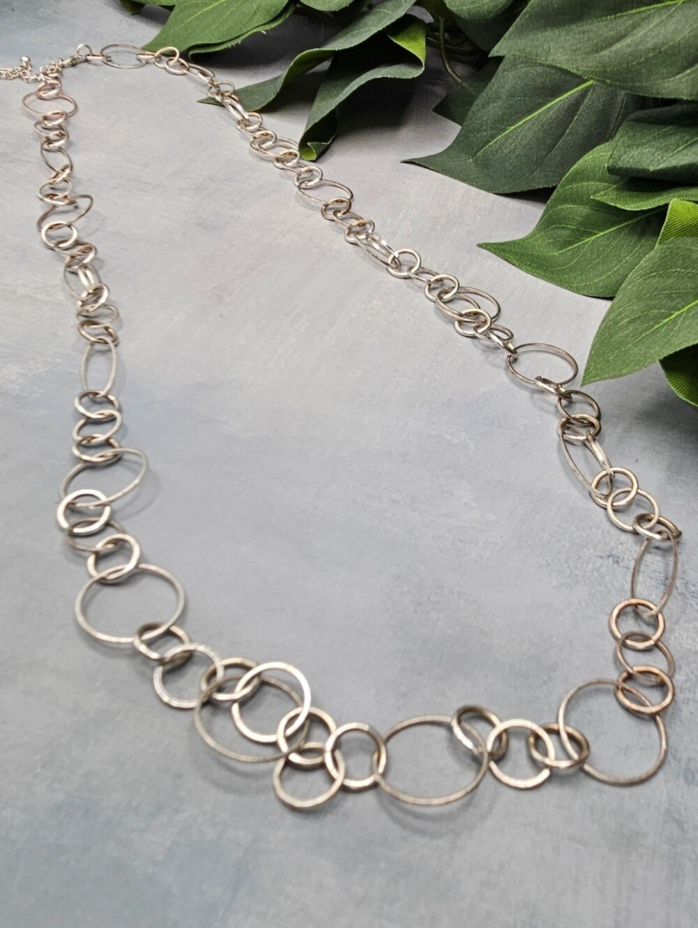 Silver Long artisan-style chain statement necklace configured in a continuous lo